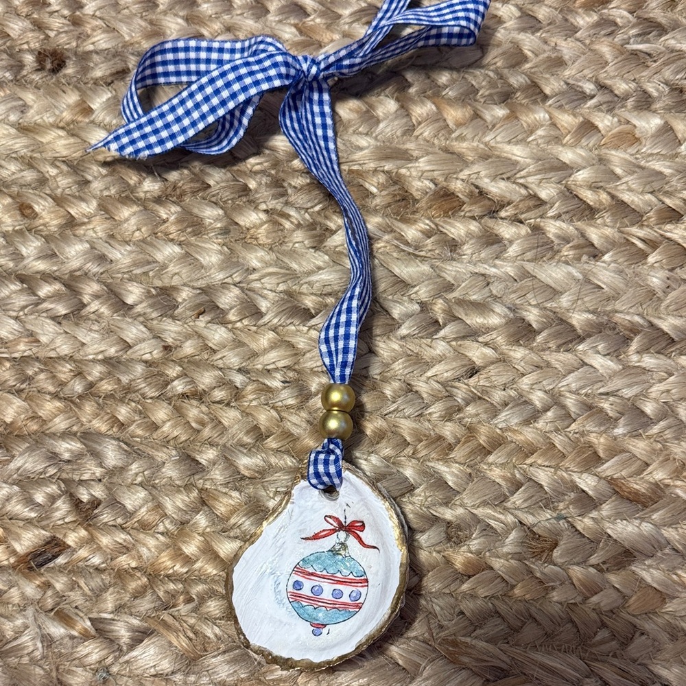 Handcrafted Ornament with Blue Ribbon